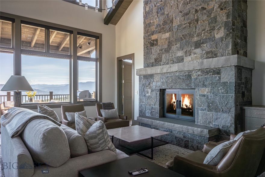 Stunningly appointed 5-bedroom, 6 bath ( 1 full, 5 3/4 ) Inspiration Point unit at Spanish Peaks Mountain Club. An end unit in a prime location, this unit is furnished to sleep up to 10 and features floor-to-ceiling windows that provide amazing views of the Spanish Peaks, the Gallatin Range, and back to Lone Peak. Not a detail is missed: gourmet kitchen with Wolf and Sub-Zero appliances, wood floors, 3 fireplaces, a large main level deck with a gas firepit, ample seating and gas grill, and a lower level patio with a hot tub. The Main level features the master suite with a gas fireplace, a large ensuite bathroom with a tub and a separate steam shower, and a walk-in closet with built-ins.
The lower level features 3 ensuite bedrooms, a family room with a wet bar and gas fireplace, a large theatre room with seating for 6, a laundry room, and a second powder room. All bedrooms have access to the outdoor hot tub and patio. 
A Signature Golf membership is available with this property, granting access to the clubhouse with dining, bar, golf/ski lockers, direct slope-side access to Big Sky, and preferred privileges at the nearby Montage Hotel. Membership application and approval, and membership deposit are required no later than closing.