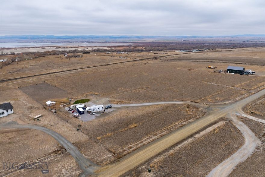 Overlooking Canyon Ferry Lake with the Big Belt Mountains in the background.  THIS LOT IS READY FOR YOUR PROJECT!!  Installed and ready to build, 400-amp Electric service, two 50-amp Full RV hook ups, 1/2 Acres fenced, Well produces 20 gallons a minute, Septic system is designed for a 4-bedroom home.