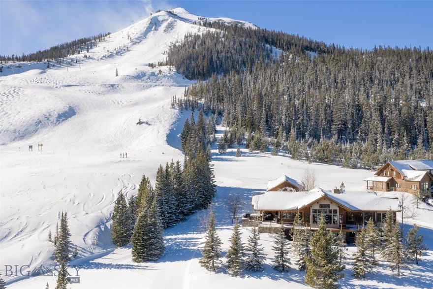 Considered one of the finest ski-in/ski-out properties in Moonlight Basin’s coveted Diamond Hitch Subdivision, 16 Half Hitch offers exceptional mountain living with direct access to Big Sky Resort and Moonlight Basin. The property features a 4-bedroom, 5-bathroom main residence plus a private 3-bedroom, 1-bath apartment connected by a fully enclosed breezeway—ideal for guests and added flexibility.
Designed for year-round comfort, radiant heat, central A/C, and an upgraded Lutron lighting control system. Entertain with ease using the Sonos sound system throughout main living areas and patio, satellite TV in all living spaces and bedrooms, and multiple indoor and outdoor fireplaces.
A gourmet kitchen is equipped with a built-in Miele coffee maker and dish drawers, while additional amenities include an elevator, dry sauna, wet bars on both levels, large-capacity ice maker, updated security systems, and generous storage with dedicated garage office space.
Set among mature aspens, the fully landscaped yard offers approximately 10,000 SF of Kentucky bluegrass, frequent wildlife sightings, and an invisible perimeter fence for pets. HOA services include snow plowing and road maintenance. Expansive outdoor living spaces capture sweeping views of the Spanish Peaks and Gallatin Range, completing this rare, turnkey ski-in/ski-out offering.