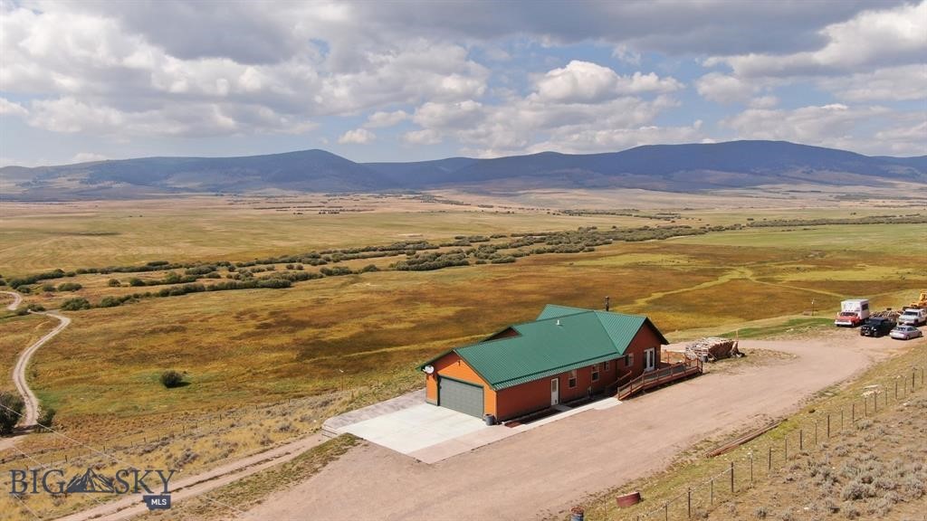 LIVE / WORK residence and business opportunity in Southwest Montana's Pioneer Mountains in Polaris, west of Dillon!
Perched high overlooking Grasshopper Creek and miles of timbered high country in the Beaverhead-Deerlodge National Forest including multiple high peaks and miles of public lands trail access. Spectacular, panoramic mountain views, and close proximity to Maverick Mountain Ski Area and Elkhorn Hot Springs. Approximately 30 miles to Dillon and 40 miles to Wise River.
The well-appointed residence is set up with two separate floors, each with independent kitchen and bathrooms, making the property ideal for short or long-term rental, outfitter quarters, or simply a wonderful home with separate living space. Detached greenhouse has electrical service.
Property is located in the heart of big game hunting and cattle country. Business is ideally suited for meat processor, servicing both domestic and wild game animal processing. The plant is professionally equipped and immaculately clean. Offers big game transport "meat frozen and delivered to your door" service.
Turn-key business includes client list, state-registered trademarks and recipes, plus all FFE, including refrigerator units, walk-in freezer, sinks, tables, slicers, smoker and all required equipment. Detailed fixtures & equipment list is available upon request. Business has dedicated propane, and shares electric and water with residence. Residence has wood stove and electric heat. Business is approximately 1890 square feet. Home was built in 2008, and business in 1998.
Land line telephone and fiber optic service is provided by Southern Montana Telephone; T-Mobile tower and Starlink services available. Location offers great commercial visibility and access year-round, yet property is set off the highway for privacy and views.
Property listing information deemed accurate; however, buyers are encouraged to verify the accuracy of all details.