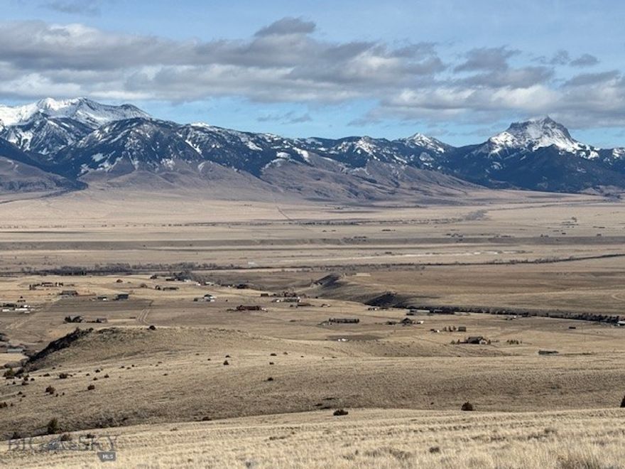Shining Mountains II, Lot 209 is a premium lot of 23.433 acres, on Haypress Lake Trail, behind the locked gate for Shining Mountains III.  The unobstructed views from this lot are spectacular, including Ennis Lake to the north, the Madison Range to the east, and the Madison River as it winds its way through the valley below.  There are power lines along the backside of the lot, affording good access to power.  This lot is ideal for building your vacation or year-around home, with lots of space, privacy and wildlife.  Shining Mountains property owners enjoy access to private stocked lakes and easy access into public lands for recreation and hunting.  Conveniently located approximately 15 miles from Ennis but very much in the country!
