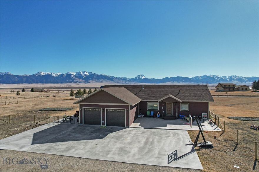 This home is positioned on the bench giving it forever unobstructed views of the Madison Mountains as well as a great view of the valley! This single level home has large vaulted ceilings with an open floor plan and separate living areas. The master bedroom is on one end of the house and the guest bedrooms and bath are on the other side of the home. The master bedroom is a nice size, has his and hers walk in closets, tiled master bathroom with double vanity, tiled walk in shower and nice sized soaker tub. The kitchen has a double oven propane range, hidden dishwasher, hidden trash can, soft close cabinets and custom silverware and knife block drawers. There is a covered concrete stamped patio out the double french doors, stamped concrete patio out the front with an additional large concrete pad extending across to the double car attached garage. Most of the property is fenced with woven wire to help contain your four legged critters or kids. This home is located in the heart of recreational paradise with the Madison River being less than 2 miles away, quick drive to the Call Road to access the Gravelly Mountains and easy access across the Cutoff Road to get on the Madison Mountains trail systems! In Montana you don't just buy a property you purchase a lifestyle!