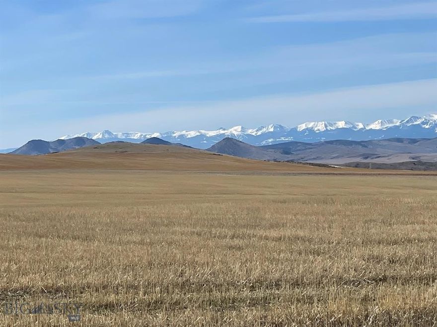 Exclusive Farmland Investment Opportunity at 154 Wheatland Road, Three Forks, MT 59752 This is a once-in-a-generation opportunity to acquire a spectacular parcel of rolling farmland strategically positioned in the heart of Three Forks' most explosive growth area. This desirable land is currently surrounded by new residential development, cementing its value as a premier investment and future development asset. The property commands unmatched, panoramic views of five distinct mountain ranges, offering a beautiful, sweeping Montana backdrop. This is a Land-Only Listing; the existing residential structure and the adjacent 5-acre parcel are expressly excluded from this sale and will be sold separately. For visionary investors, the property has a significant history: entitlements for a 2,700-lot Master Planned Subdivision have been approved through 2047. Please note: These valuable development approvals and entitlements are sold separately from the land itself.