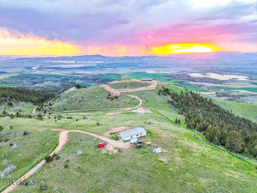 Come experience living in Big Sky Country with this off-grid retreat offering unmatched views and sustainable living. Located in the greater Three Forks area, this two-bedroom, two-bath home sits on just over 10 acres with sweeping vistas of the Missouri River, Canyon Ferry Lake, and surrounding mountain ranges.
This energy-efficient home is powered by a 2,500 kW solar system and features a 14,000-gallon rainwater collection cistern, on-demand water heater, allowing you to enjoy all the modern amenities while living independently. The open floor plan, vaulted ceilings, and picture windows bring the outside in, framing the beauty of the landscape from every room. You’ll stay connected with reliable cell service and Wi-Fi, and a snow plow truck conveys to help maintain year-round access. Whether you're seeking a weekend retreat or a full-time off-grid lifestyle, this property delivers peace, privacy, and true Montana living.  Schedule your showing, today!