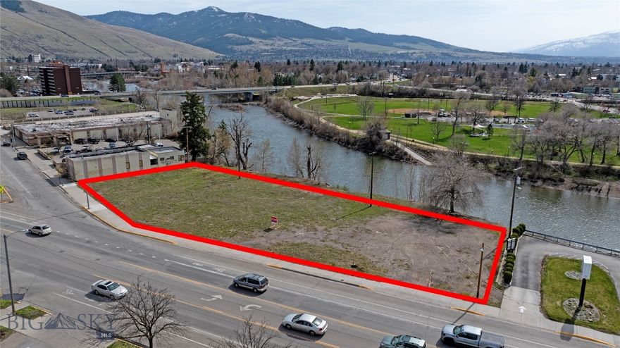 This prime development parcel is one the last remaining developable lots in downtown Missoula.  Exceptional south-facing mountain and river views.  Situated on the Clark's Fork river  directly across from Providence St. Patrick Hospital, this parcel, zoned CBD-4 allows for multiple commercial uses: multi-family, mixed-use, office or hospitality, and up to 125' height.  
The parcel is connected by the riverfront trail along the central business district to the University of Montana and into National Forest.  Right-of-Way Street Vacation includes agreement to grant public utility and riverfront trail access easements.  Riverfront development includes plans for an Event Center & Hotel on adjacent waterfront parcel.  Tax Increment Financing available for utility, infrastructure, and other improvements.  Possible seller financing available to qualified buyers.  
Engineered Site Map, Professional Geo-Technical Report, Phase II Environmental Site Assessment, and Redevelopment Agreements Available Upon Request.  Just 10 Minutes to Missoula International Airport.  
See architect's renderings for possible development concepts.  Buyer to verify all details.