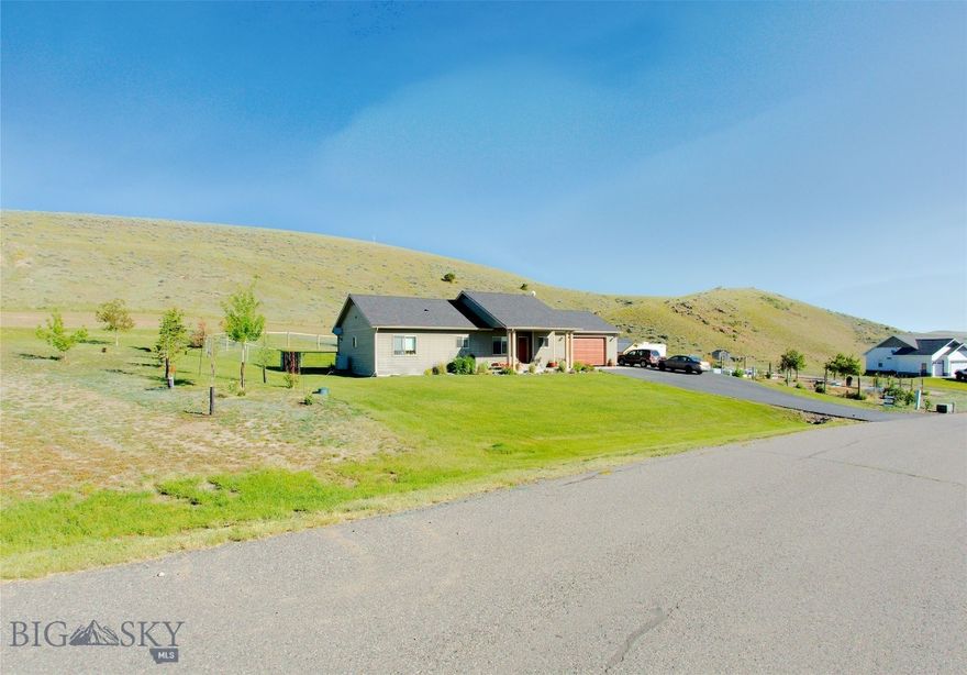 5 BEDROOM HOME ON 2 LOTS! Fabulous location in Village at Elk Ridge, Backing to the hills and park area with Panoramic views. Built in 2013 this home has so many amentities including; white oak flooring, underground sprinklers, central air conditioning, storage shed, family room downstairs, beautiful front porch to put your rocking chair, and additional lot for gardening or future development. This house is comfortable and a delightful place to call home.