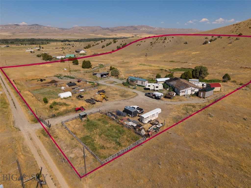 Organically stewarded for over a decade, this 9.715-acre retreat is primed for sustainable living, livestock management, and space for recreation. The square parcel ensures privacy without the squeeze of neighboring parcels, while the location offers peace and quiet.
The land features a 5 bedroom septic system, gravity-fed irrigation reaching every corner, 8 frost-free hydrants (7 powered), and multiple animal shelters and pens. An extensive dirt bike track offers recreation, while Hugelkultur berms, swales, and check dams demonstrate a serious commitment to soil health and water retention.
The garden infrastructure includes fertile raised beds, perennial fruit plantings (apple, cherry, plum, raspberry, serviceberry), and soil enriched with years of compost, amendments, and cover crops. Rotational grazing practices and well-drained, graveled paddocks support a healthy livestock operation.
Additional features include a new insulated storage shed with power, separate toolshed, hay storage, and ample parking and drive space. If you're looking for a property that supports your lifestyle, whether that's homesteading, hobby farming, or regenerative agriculture, this one is productive and ready to grow.