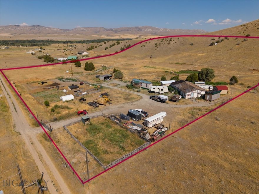 Organically stewarded for over a decade, this 9.715-acre retreat is primed for sustainable living, livestock management, and space for recreation. The square parcel ensures privacy without the squeeze of neighboring parcels, while the location offers peace and quiet.

The land features a 5 bedroom septic system, gravity-fed irrigation reaching every corner, 8 frost-free hydrants (7 powered), and multiple animal shelters and pens. An extensive dirt bike track offers recreation, while Hugelkultur berms, swales, and check dams demonstrate a serious commitment to soil health and water retention.

The garden infrastructure includes fertile raised beds, perennial fruit plantings (apple, cherry, plum, raspberry, serviceberry), and soil enriched with years of compost, amendments, and cover crops. Rotational grazing practices and well-drained, graveled paddocks support a healthy livestock operation.

Additional features include a new insulated storage shed with power, separate toolshed, hay storage, and ample parking and drive space. If you're looking for a property that supports your lifestyle, whether that's homesteading, hobby farming, or regenerative agriculture, this one is productive and ready to grow.