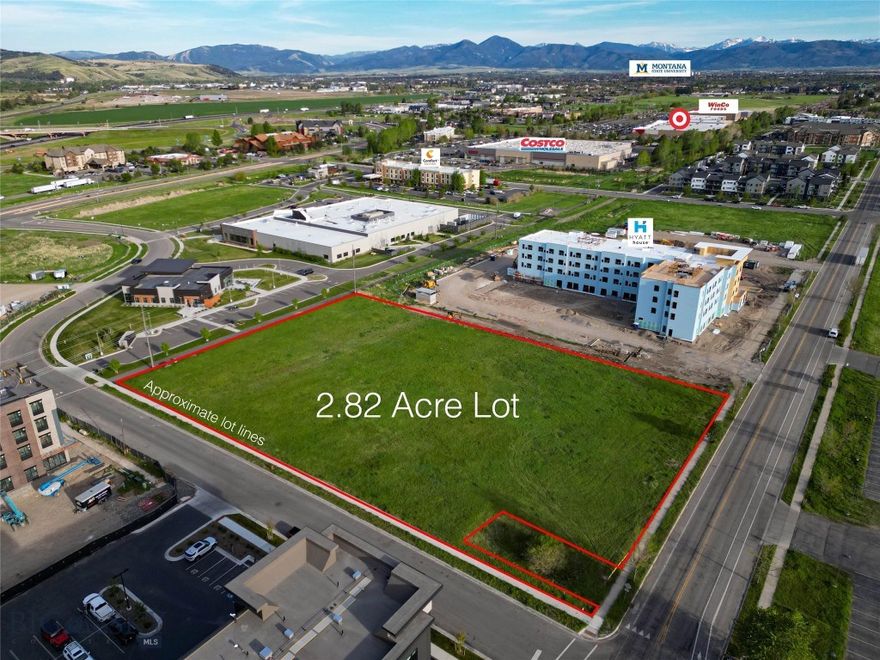 Prime 2.822 acre commercial lot in booming northwest Bozeman! Set amidst one of the fastest growing areas in town, this lot is located next to or just minutes from numerous hotel properties, restaurants, class A retail and office spaces and major medical facilities. Convenient location is in the heart of the prime retail shopping area of Bozeman with major retailers such as Costco, Target and WinCo foods just a stone’s throw away. Easy access off I-90 at N 19th Ave. Excellent traffic counts on area roads. According to available documents – B-2 Community zoning in the new UDC vertical massing can potentially go to 90’ in height with up to 250’ of building width and allows for a variety of uses– buyer to verify. Only 7 miles from Yellowstone International Airport – which had 2.64 million passengers in 2024. 1 hour to Big Sky and Yellowstone Club/Moonlight Basin/Spanish Peaks resorts. Level building site, within city limits, sidewalks are in place. Subject to light covenants for commercial (non-residential) use only – no active POA. Buyer to verify all listing information independently and to their own satisfaction.