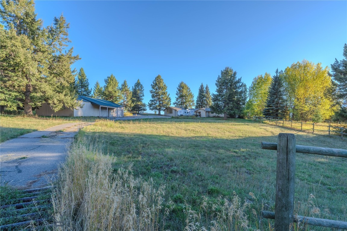 Unique and picturesque, this wonderful home overlooking beautiful Hebgen Lake presents a remarkable opportunity for those seeking a private vacation retreat or a perfect residence nestled within a serene and quiet neighborhood. The property’s location ensures privacy and tranquility, making it ideal for relaxation and leisure.
Boasting breathtaking lake and mountain views, this spacious 3,600 square foot home embodies rustic living with a nostalgic touch. The natural surroundings and charming setting create an inviting atmosphere, perfect for enjoying the beauty of the outdoors from the comfort of home.
The main floor of the home features two bedrooms and two bathrooms, offering comfortable accommodation for residents and guests. Additionally, there is a third room that can easily be converted into a bedroom, office, or den, providing versatile living space to suit individual needs. The living room and dining room are thoughtfully designed to maximize views of Hebgen Lake, allowing residents to appreciate the stunning scenery throughout the day.
The kitchen and large dining room are perfectly suited for entertaining friends and family, with ample space for gatherings and celebrations. Adjacent to the dining room is a spacious artist studio, complete with large windows that fill the space with beautiful natural light—an ideal environment for creative pursuits and relaxation.
The property is comprised of three lots with abundant outdoor space, offering endless possibilities for gardening, recreation, or future expansion. Mature trees and native landscaping enhance the sense of seclusion while providing shade and a harmonious connection to nature. Whether you envision adding a guest house, building a workshop, or creating outdoor entertaining areas, the land presents numerous options to customize the retreat to your preferences.