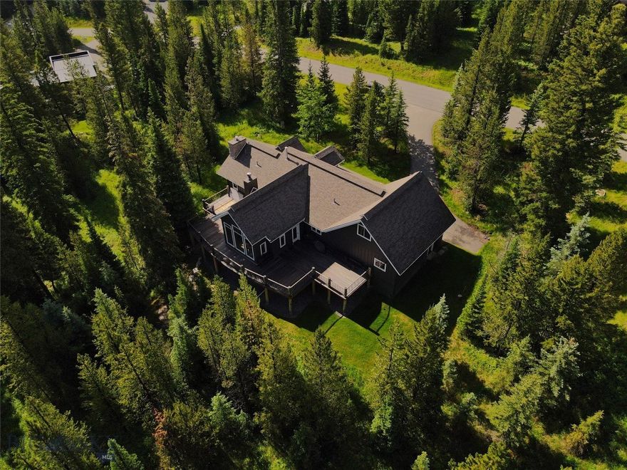 Luxury Mountain Family Living in the Aspen Groves subdivision in Big Sky, Montana. Embrace this meticulously cared for 4-bedroom, 5-bathroom home nestled in at 83 W Pine Cone Terrace on an expansive 1.485 acre corner lot. Situated six minutes from Big Sky Town Center and twelve minutes from Big Sky Mountain Village, this home features high ceilings, large view windows and three cozy fireplaces, 2 gas and 1 wood burning. It was built in 2001 with a generous 3852 Square feet. Recent upgrades include new kitchen appliances and washer/dryer in 2021, new exterior paint in 2022 and a new asphalt Cold-Roof in 2023. The home is heated with a very effective radiant floor and radiant slab heating. Four spacious En-suite bedrooms provide comfort and privacy for residents and guests. Enjoy first level living convenience of the main bedroom, living area, kitchen, laundry and attached heated double-car garage with storage space. Close proximity to ski slopes, hiking trails and community amenities and services. Indulge in the ultimate mountain retreat at Aspen Groves, where luxury meets wilderness in the heart of Big Sky Resort. Whether you're seeking a seasonal getaway or year-round residence, this home offers Montana's vibrant outdoor lifestyle. Arrange a private tour today and envision your future in this mountain sanctuary.