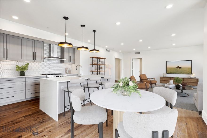 Light and bright, this unit in The Henry, a six-story luxury condominium building in Downtown Bozeman, #301 has a bright and airy feel to it. Sitting on 1,536 SF with two bedrooms, two bathrooms, and a 119+- SF heated balcony, this unit has it all. With engineered oak hardwood floors, wool carpeting, quartz countertops and Bosch appliances to go with high-end fixtures and tons of natural light, this condo is a ready-made luxury offering in the heart of the Rocky Mountains’ coolest town. And it doesn’t stop there - The Henry building has amenities that make it more than just a residence: a ground floor fitness center, a private, landscaped courtyard and climate-controlled, secure underground parking. Just three blocks from Main Street, twenty-five minutes to Bridger Bowl and forty-five minutes to Big Sky Resort, you'll have easy access to the vibrant downtown scene, outdoor recreational activities, and Montana's stunning natural landscapes.