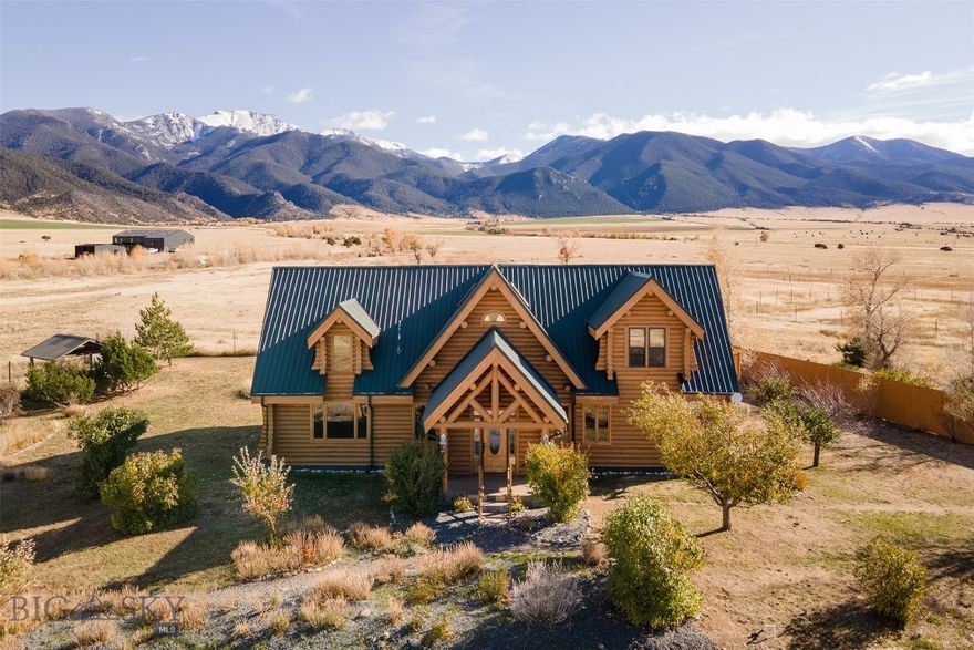 Welcome to 18 White Rock Lane, a serene Montana retreat in the heart of the Jefferson River Valley, where every season brings breathtaking views of the Tobacco Root Mountains and the surrounding rural landscape. Set on 20 private acres in the hamlet of Waterloo and bordering 502+ acres of state land, this 3,180± sqft log home combines the natural warmth and character of handcrafted logs with thoughtful modern updates. The main level features vaulted ceilings, floor-to-ceiling windows, a stone fireplace that anchors the living space, half-bath with laundry, and a kitchen with a large cooking island, walk-in pantry, and dining area filled with sunlight from new 2025 windows. The main-level primary suite offers a peaceful retreat with a walk-in closet, private walk-out to the back deck, and remodeled 2023 bathroom complete with jetted tub and walk-in shower. Upstairs are two bedrooms and a full bath, providing comfortable space for family or guests, while the unfinished basement offers ample storage. The property is perfectly designed for equestrian living, with fenced pastures, indoor stalls, and a large barn/shop featuring a 600± sqft guest apartment above, ideal for extended family, visitors, or rental potential. Additional amenities include a detached three-car garage, 30x42 greenhouse, chicken coop, and cedar sauna building. The home and outbuildings were freshly stained in 2024, and new carpet was added in 2023. Mill Creek, a seasonal spring creek, winds gently through the property, creating a peaceful backdrop that complements the open setting. Located just 13 miles south of Whitehall, 20 miles north of Twin Bridges, and within roughly an hour of Belgrade or Bozeman, this property offers the perfect balance of rural privacy with convenient access to nearby amenities. 18 White Rock Lane delivers warmth, comfort, and the quiet luxury of country living.