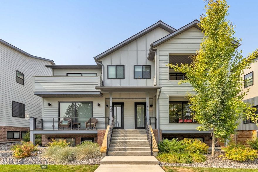 Contemporary living with an ADU, just blocks from downtown Bozeman! This spacious townhome offers a thoughtful layout with an open kitchen, living, and dining area on the main level, filled with natural light and inviting outdoor spaces. Upstairs, the generous owner’s suite includes a covered porch to enjoy the morning sun, a spa-like bathroom, and a versatile office or sitting area. The lower level features two bedrooms, each with en-suite bathrooms and private patios, along with a laundry room and additional storage.
A rare two-car garage anchors the property, topped by a one-bedroom ADU apartment with its own large deck — ideal for guests, rental income, or multi-generational living.
Located on North Willson, just four blocks from Bozeman’s vibrant and historic Main Street, you’ll have restaurants, shops, galleries, and nightlife at your fingertips. Beyond downtown, Bozeman offers an unmatched lifestyle: quick access to the Bridger Mountains for skiing, biking, and hiking, nearby trails and rivers for year-round outdoor recreation, Montana State University’s cultural and educational opportunities, and a welcoming community known for its balance of small-town charm and big-city amenities.
This property blends modern comfort, investment potential, and the best of Bozeman living.