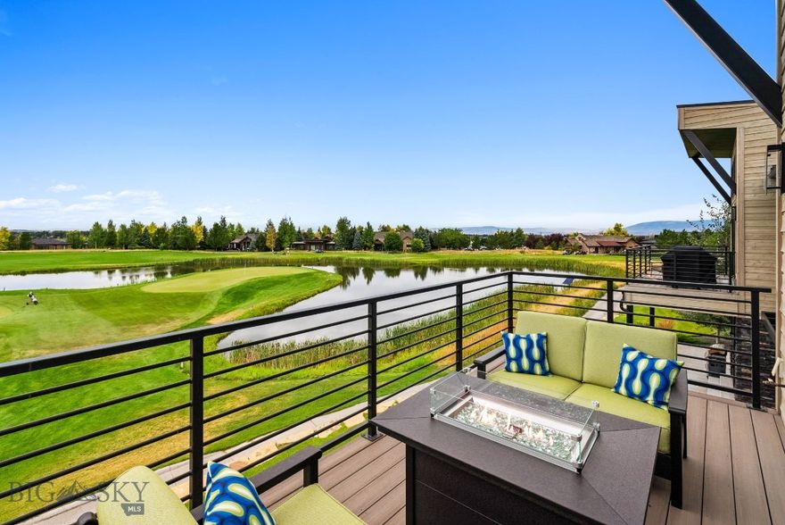 MUST-SEE UPPER LEVEL VILLA: Black Bull’s golf course is in full summer glory, and this custom-designed upper-level Villa puts you right in the heart of it. Overlooking the 9th and 1st fairways, with the course lake and Tobacco Root Mountains as your backdrop, the views are nothing short of spectacular. Inside, 15-foot pitched ceilings frame massive windows, flooding the open living and kitchen areas with light. Designer touches shine throughout — custom tilework, textured wallpaper accents, and handpicked lighting — paired with features like a stone fireplace, wine bar, quartz island, and stainless-steel chef’s appliances. Two spacious primary suites each offer walk-in closets with high-end finishes, spa-like baths, and course views. A versatile bonus/den space provides room to relax or work. Extras include a walk-in pantry, powder room, automated window coverings, A/C, heated garage with storage closet, private entry vestibule, and water softener. Just steps from Black Bull’s private restaurant, clubhouse, pool, and fitness center, this “lock & leave” Villa offers effortless living — with HOA covering snow removal, mowing, landscaping, trash, and exterior maintenance. Some photos are club amenities. Please inquire for a full tour.