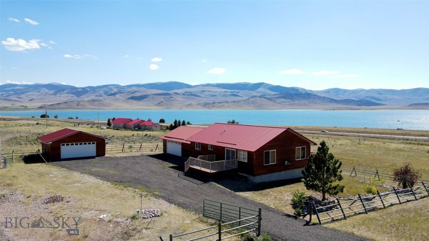 Montana Escape: Enjoy breathtaking Clark Canyon Reservoir views from this charming home on 28.34 acres bordering State Land and BLM! Ideal for outdoor lovers with access to hiking, fishing, hunting (general elk tag area), and floating the Beaverhead. Inside, discover abundant natural light, an open concept living area, 4 bedrooms, and 3.5 baths perfect for families and guests. Benefit from an oversized attached 2-car garage plus an additional garage for all your gear.  Embrace Montana living!