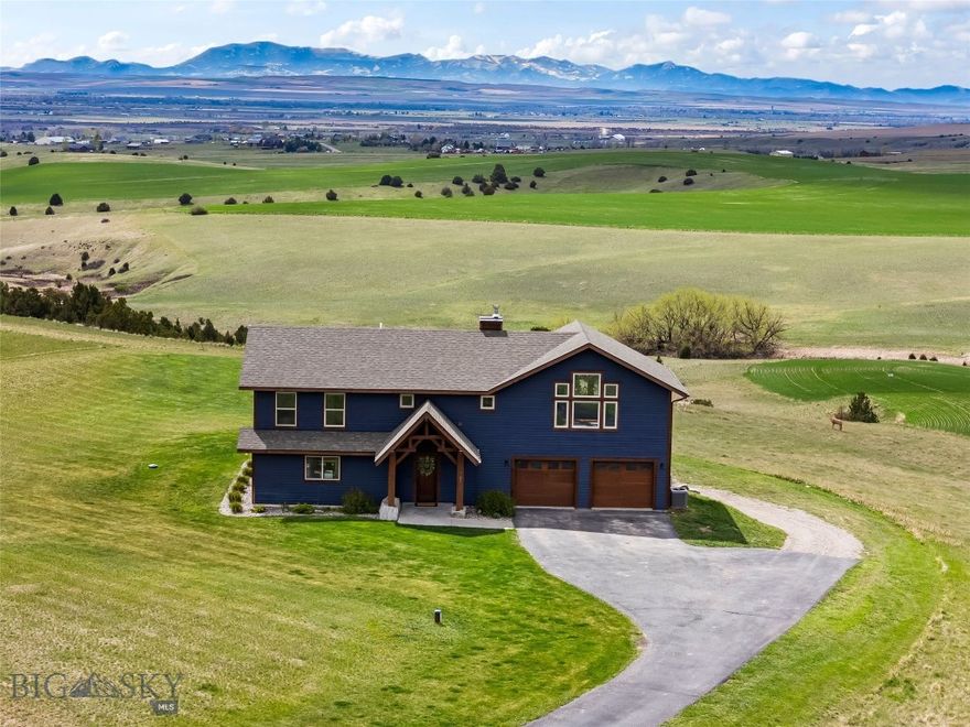 Set on over 1.5 acres just north of Belgrade, this beautifully crafted 3-bedroom, 3.5-bath home offers a rare blend of privacy, character, and sweeping Montana views. Thoughtfully designed with exposed timbers, warm wood accents, and expansive picture windows, the home captures breathtaking panoramas of the Bridger Mountains and the Gallatin Valley from nearly every room.

The open-concept living space is filled with natural light and anchored by rustic architectural details that create a welcoming, mountain-modern feel. Each bedroom offers comfort and privacy, while additional living space provides flexibility for entertaining or relaxing.

Step outside to enjoy the peace and openness of the surrounding landscape—this property borders subdivision open space, which directly connects to 320 acres of landlocked State Land, offering an exceptional buffer from future development and added room to roam right from your doorstep.

With its combination of scenic beauty, quality craftsmanship, and a highly desirable location just minutes from Belgrade and a short drive to Bozeman, this property delivers the best of Montana living