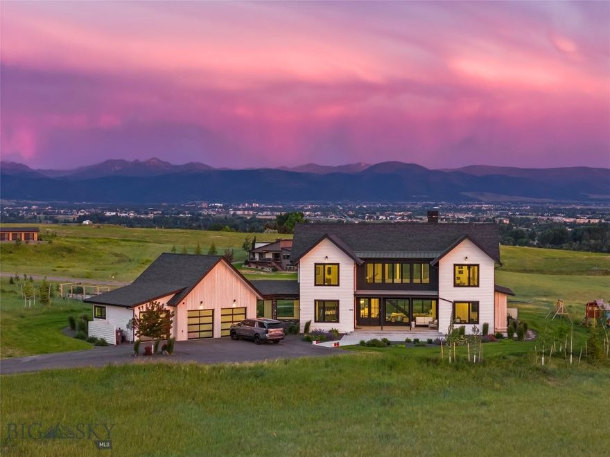 Perched atop the premier lot in Springhill Reserve, this stunning custom home captures some of the most breathtaking views in all of Bozeman. Set on 1.51 acres, the 4-bedroom, 3.5-bath, 3,577 sq ft residence was thoughtfully designed to blend luxury, functionality, and natural beauty.

As you arrive via the tree-lined driveway, the panoramic views immediately impress. Inside, a chef’s dream kitchen awaits, featuring high-end Thermador appliances, including a built-in 36” refrigerator and 18” freezer, dual dishwashers, a built-in coffee station, oven, speed oven, and a 36” range. A custom dumbwaiter makes transporting items to the spacious upstairs living area effortless, where a built-in bar and expansive family room offer the perfect setting for entertaining.

Wine lovers will appreciate the striking 150+ bottle wine rack—both a storage solution and a conversation piece. Throughout the home, 8-foot doors and high-end finishes reflect careful attention to detail. The lower-level living space boasts vaulted ceilings and a wood-burning fireplace with a gas-assist start, creating a warm and inviting atmosphere.

Step through oversized glass doors onto the expansive south-facing patio, complete with a gas fireplace and sweeping views of the Gallatin Valley. The front office enjoys uninterrupted views of the Bridger Mountains, ideal for a serene work-from-home setup or a private fitness space. Each bedroom features custom closets, blending elegance with practicality.

Ideally located just 4 miles from downtown Bozeman and 5 miles from Yellowstone International Airport, this home offers both convenience and serenity. Springhill Reserve residents enjoy nearly three miles of private walking trails, a tranquil pond, and over 50 acres of open space—making this property an exceptional blend of comfort, lifestyle, and location.