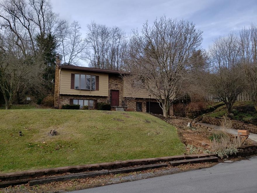 Situated on nearly a one-half acre lot, this 3 bedroom, 2 bath home features a large living room with plenty of natural light, a well-appointed eat-in kitchen, and formal dining room.  The bedrooms are spacious, and there is plenty of storage space for you and your stuff.  The lower level is completely finished and includes a freshly painted family room, complete with a natural gas fireplace.  Additionally, there is an over-sized laundry, a full bath, and bonus room in the lower level.  The bonus room could easily be made into a home office or craft/hobby room or could retain its current use as a walk-in shoe closet.  Enjoy the summer months by the secluded in-ground swimming pool, or kick back after a long day in the hot tube.  Call the listing agent today to schedule your private tour!