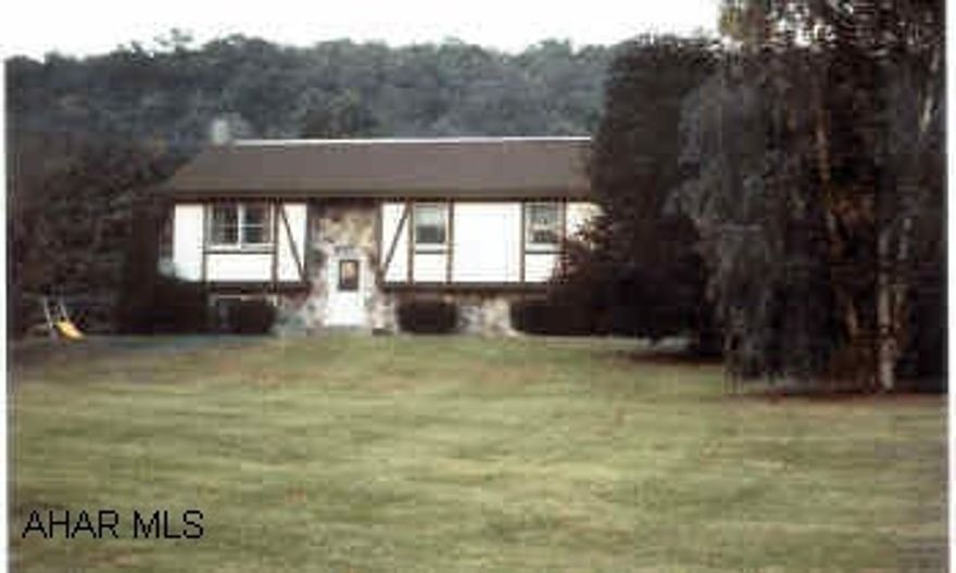 Well kept home with exceptional panoramic views. Stucco/stone exterior. Light and airy floorplan, neutral throughout.  New roof in 10/04;, finished basement, deck, laundry room, dishwasher, pellet stove, outbuildings.