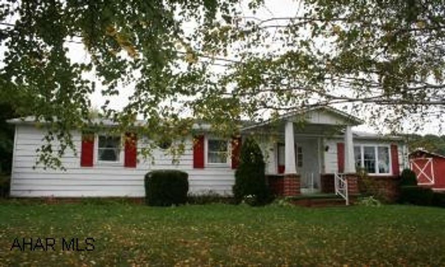 Brick/Aluminum Ranch in country setting with convenience of being 4 miles from Bedford. 3BR/1.5BA, eat-in kitchen, large LR w/cathedral ceilings & beams. Finished basement has large FR, game room, summer kitchen and storage room. Enclosed back porch, small barn with carport, large yard with pine trees, apple, pear and English walnut trees and grape arbor. 19'x24' barn w/carport.