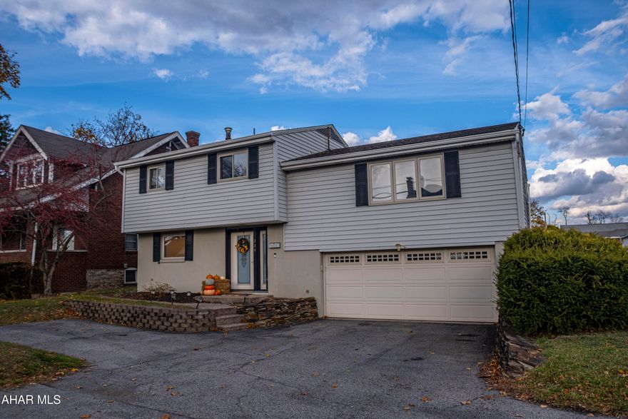 Welcome to this inviting raised-ranch, multi-level home in Altoona, offering a spacious layout and a convenient location close to restaurants, shops, and everyday amenities. The main level features a warm and welcoming flow with attractive wood-look flooring throughout the living room, dining room, and updated kitchen with included appliances. Three comfortable bedrooms and 1.5 baths provide practical living space, while the split-level design offers great separation and flexibility for daily life.
A highlight of the home is the screened-in back porch and sunroom, a relaxing space perfect for enjoying morning coffee, casual meals, or quiet downtime. The level, fenced yard adds even more usable outdoor space. Additional features include central air, natural gas hot water heat, a wide driveway, and a spacious 2-car garage with excellent parking and storage. This well-loved home is move-in ready and perfectly positioned for comfort and convenience in Altoona.