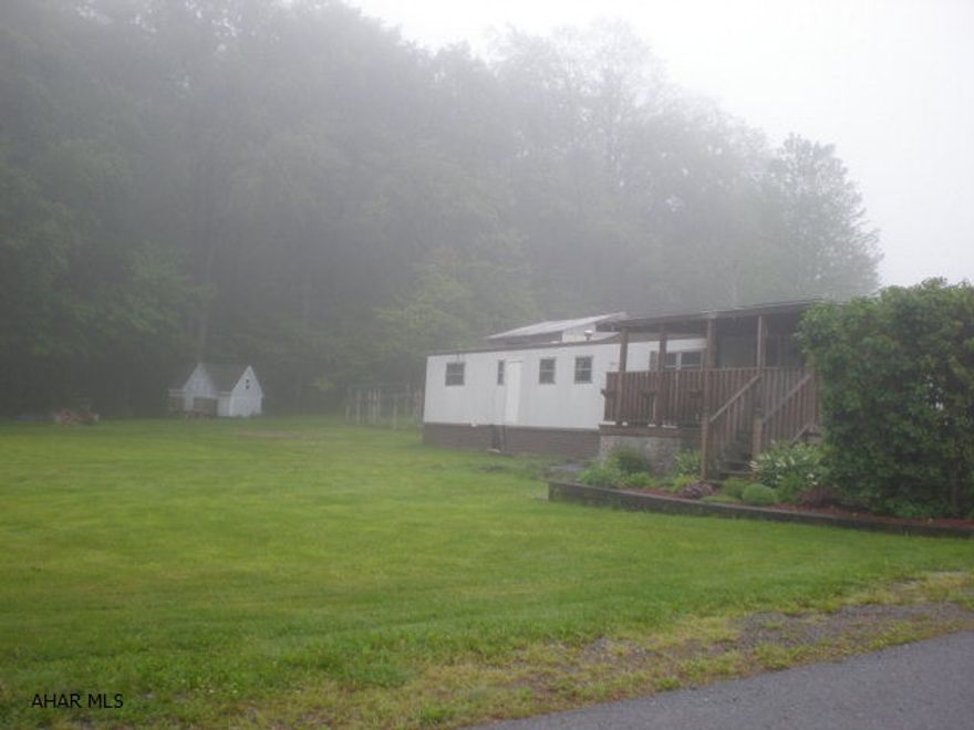 Beautiful building site. Currently has mobile home on - can be included or removed (poor condition). Shed on property. Nice homes on this street.