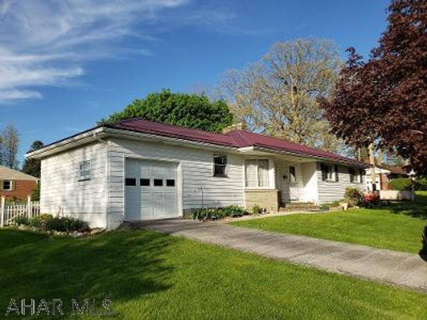 3-bedroom home with hardwood floors, new metal roof (2020), 2 fireplaces, level lot, attached 1-car garage, enclosed back porch & fenced back yard on .22 acre lot in beautiful neighborhood & 1 block to Morrison Cove Memorial Park! J-586.  Seller just had exterior of home painted.