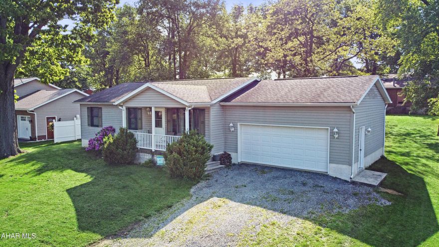 Built in 2001, this stunning ranch-style home has been meticulously maintained since its inception. Nestled on just under a quarter acre within the Portage School District, this property offers a welcoming atmosphere. As you enter the main floor, you're greeted by a charming tiled foyer that leads into a cozy living room featuring new carpeting. The inviting dining room flows into a spacious kitchen, complemented by two additional bedrooms & a master suite complete w/ a full bathroom. A guest full bathroom conveniently serves the main level as well. The finished basement adds valuable living space, featuring a family room w/ a gas fireplace, a craftsman area, a half bathroom w/ laundry, & ample storage. The exterior boasts an attached two-car garage, off-street parking, a covered front porch, & a generous yard, perfect for outdoor activities. This home has so much to offer! Call today for a private tour!