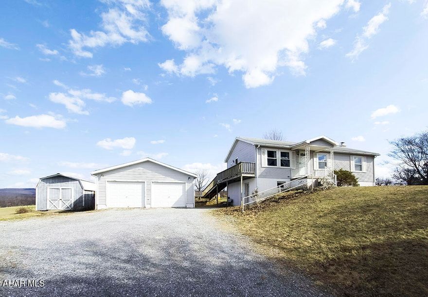 Nestled in the peaceful rural setting of Martinsburg, this well-kept raised ranch offers comfortable living on approximately 1 acre with beautiful open views of the surrounding countryside. The home features 3 bedrooms, 2 bathrooms, and a partially finished basement that provides additional flexible living space for a family room, recreation area, home office, or hobby space. The main level offers a functional layout with a bright living area, spacious eat-in kitchen, and nicely sized bedrooms. Outside, enjoy the large yard with plenty of room for play, gardening, or simply taking in the scenic setting. A 2-car detached garage provides excellent parking and storage. This property offers the appeal of country living while still being within convenient reach of local amenities.