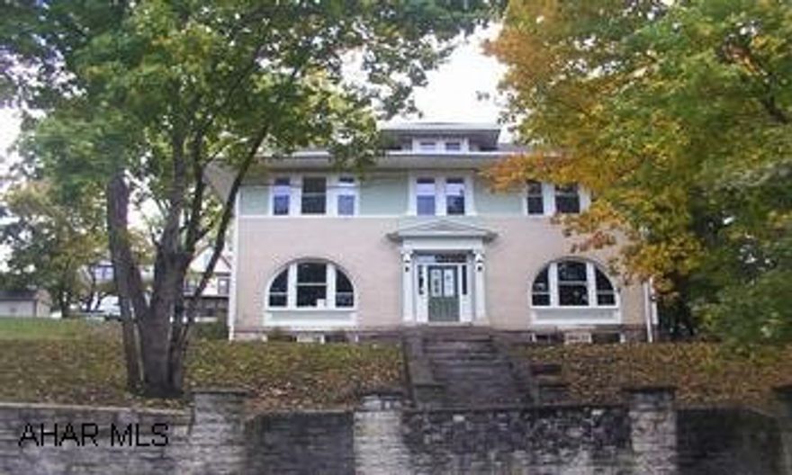 Beautifully remodeled Colonial home with hardwood floors, pocket doors, wood ceiling beams, window seats, twin ceramic tile fireplaces, formal entry with open staircase, new carpet, windows, doors on private 1/2 acre lot, off- street parking, two furnaces with separate thermostats.