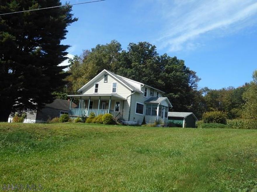 Partially remodeled two story family home on a one acre lot. Beautiful modern oak kitchen, large living room, dining area and half bath.  4 bedrooms and bath on second floor.  Large two story garage measuring 38x45 that needs work. Pole type garage/workshop measuring 18x52 built in 2007. Prince Gallitzin State Park land is across the road. Nice rural setting near the park. Lots of hunting and outdoor activities nearby.