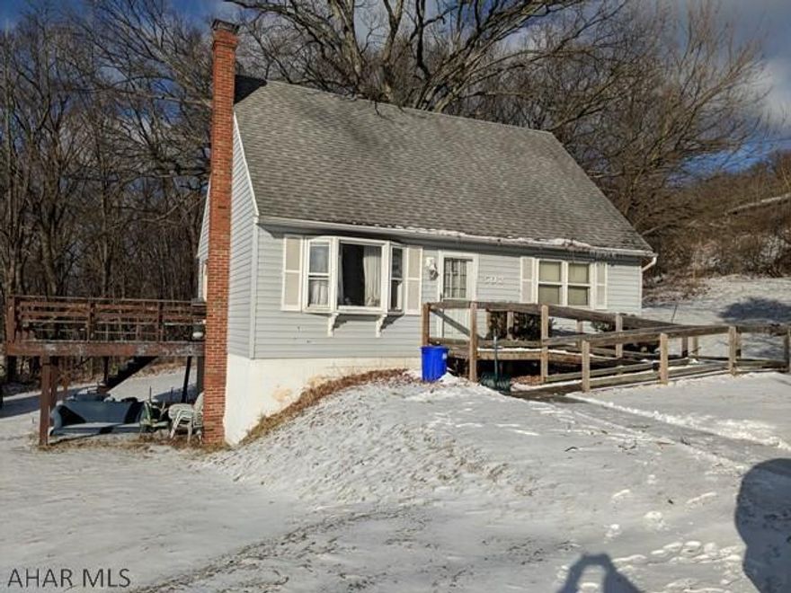 Attention Investors! Assessed at $106k 3 dimensional shingle roof and vinyl siding. Handicap Ramp on a double lot. Needs a kitchen and both bathrooms - this property will need a total inside remodel.