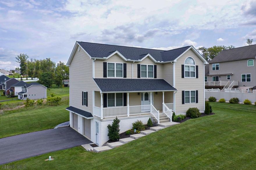 Colonial Style 2 story home in the highly desirable Rolling Hills North Subdivision.  Built by Campbell Builders, the home features 4 bedrooms and 2.5 baths.  Hardwood flooring throughout much of the 1st floor.  The beautiful eat-in kitchen has ceramic tile floors, quartz countertops, and included stainless steel appliances (brand new dishwasher)!  Large deck off the kitchen area perfect for relaxing and entertaining.  Formal dining room and living room.  Upstairs you will find a spacious master suite with full bath and walk-in closet.  On the second floor you will also find 3 additional bedrooms and a second full bath.  Plenty of extra storage space throughout the home. Finished basement with an oversized two car garage, complete with an additional storage area.