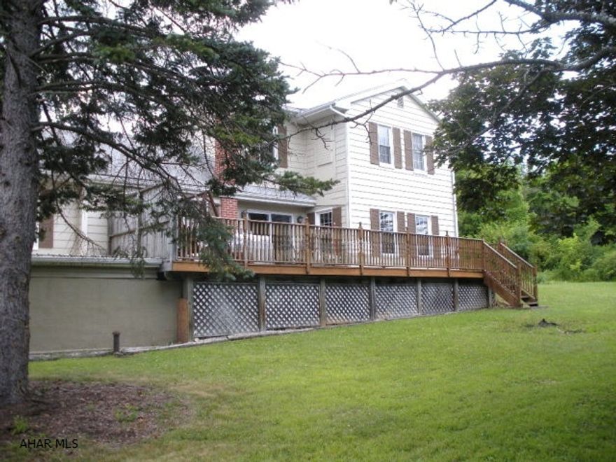 Situated on a large corner lot, this 4 bedroom 2 bath home is a great place to call home.  the interior of this home is well cared for and updated, the oak kitchen has all the appliances, and there is room for an eat in area also.  The entire home has new Mohawk carpeting and new under padding.  The second floor master bedroom has tons of natural light, a walk in closet and an updated full bath.  The bonus room could be an office or a nursery.  Enjoy friends and family on the large deck overlooking the 116 x 120 lot. There is a 1.5 car garage for lots of storage.