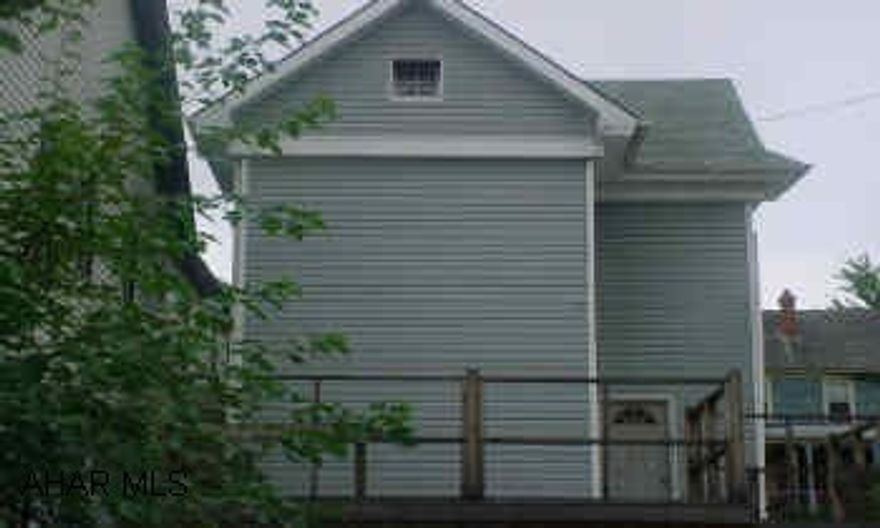 Property to be sold "as-is" - to settle estate.  Exterior is done - newer roof and vinyl siding, some new windows.  100 amp electric.  Interior needs finished.  No furnace. Hot water baseboard units are in place. Large deck.