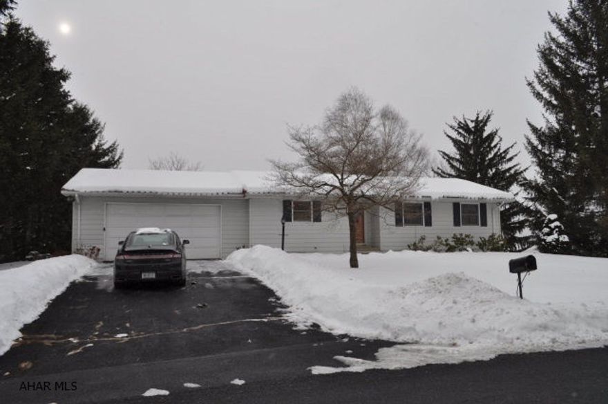 MINUTES FROM STATE COLLEGE THIS 3 BEDROOM RANCH HOME WITH A VIEW. IS READY TO GO, NEW ROOF,HARDWOOD FLOORING,LARGE LIVING ROOM HAS BUILT IN BOOKSHELVES WITH FIREPLACE,GOOD SIZE BEDROOMS, UPDATED KITCHEN THAT INCLUDES DISHWASHER & REFRIGERATOR. ENJOY THE VIEW FROM A INCLOSED SUNROOM THAT LOOKS OVER A 1/2 ACRE LOT. THERE IS A FUNISHED BASEMENT WITH A BONUS ROOM AND LAUNDRY AND 1/4 BATH PLUMBED IN FOR A TOILET . OVER SIZED 2 CAR GARAGE.