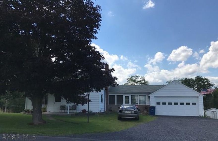 Have it all for an affordable price! Over 5 acres of privacy and beautiful views. Spacious split level with huge master suite. Bonus room could be big walk in closet. Eat in kitchen, pantry and living room with natural light. Preserved hardwood floors under carpet. Big sun room/breezeway for relaxing. Flat lot with just enough wooded area for walking paths. Turkey and deer are frequent guests. Two car garage and shed. Very quiet road makes this a perfect family home. Just 15 minutes from Rocky Gap. Book your showing today!