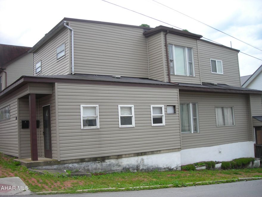 Nice 2-unit investment. Presently vacant. There is a one car garage. Please do not walk on garage roof needs repaired. Could be turned back into single home. Being sold as is, where is. Seller will make no repairs.