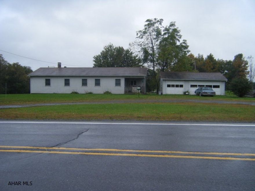 The total acreage of the site is 10.455. The parcel is severed by New Route 22. There is 2.761 acres on the West side of New Route 22. This is accessed by a paved township road. It is low end value property. The main site is 7.694 acres and fronts on Old Route 22 (Admiral Peary Highway). There is a ranch style home, 3 car garage and mostly level terrain.