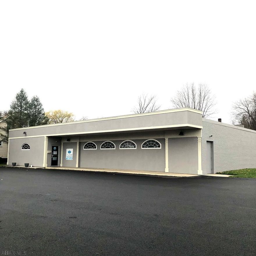 Beautifully renovated Brick and Concrete Block building for may uses ... Professional services, retail, offices, church etc.  3236 Square feet.  Zoned Neighborhood Business. At present the building is a Yoga Studio/Wood shop. Flat rubberized roof, insulated casement windows and exterior security lights. Interior includes Lobby, Office, 2 ADA bathrooms, storage room and 2 Large gathering rooms .All new flooring! Building sketch attached. There are two roof mounted gas FHA furnaces and A/C Unit. Level site with  large macadam paved parking lot (app. 23)