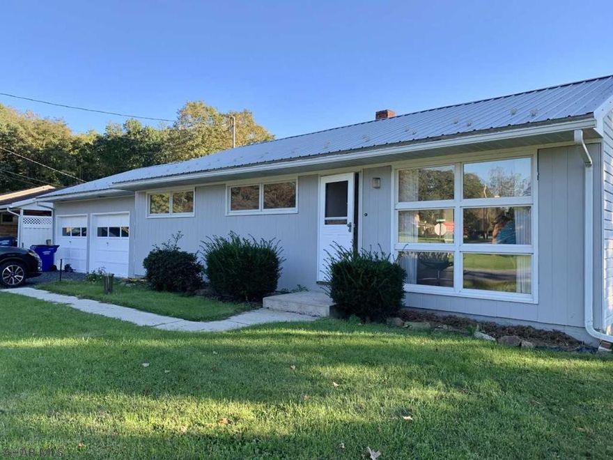 Lovely recently renovated rancher with two car attached garage.   Kitchen and bathroom entirely remodeled in 2021.  Entire house has been repainted in pleasant neutral shades.  All carpet was taken out and beautiful  hardwoods adorn the LR, hallway  and all bedrooms.  3 sources of heat:  Heat pump, Oil/forced air furnace and a wood burning stove in the partially finished basement.  Recently installed security system will need to be activated by buyer.   Metal roof was recently installed.   Quiet residential street.   Don't miss this one !!