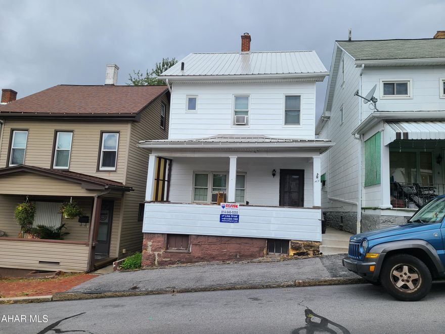 This 4 bedroom, 2 bathroom home has a recently-remodeled interior.  There is an eat-in kitchen, a living room, a bedroom, a 3/4 bath, and laundry area on the first floor.  There are 2 bedrooms and a full bathroom on the 2nd floor.  The 4th bedroom is on the 3rd floor. The backyard is fenced on the sides and open in the back for off-street parking.  The metal roof was installed in 2020.  There is a covered front porch and a covered back patio.