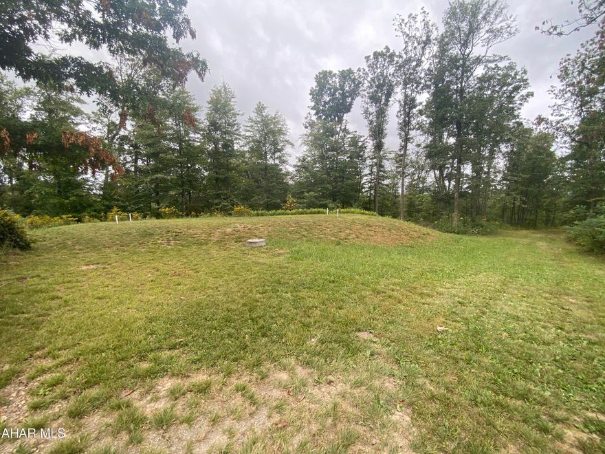 Looking for the perfect secluded building lot? Right here it is! 3.5 acres of privacy and nature with utilities ready to go. So much opportunity for this lot in Chestnut Ridge. Sand mound, well, electric and telephone line already on site. 32x60 ft. excavation site has been created for possible home foundation. An additional 1.39 acres also available. Contact listing agent for more info. Need owner financing? Options available! Contact listing agent for more information on terms.