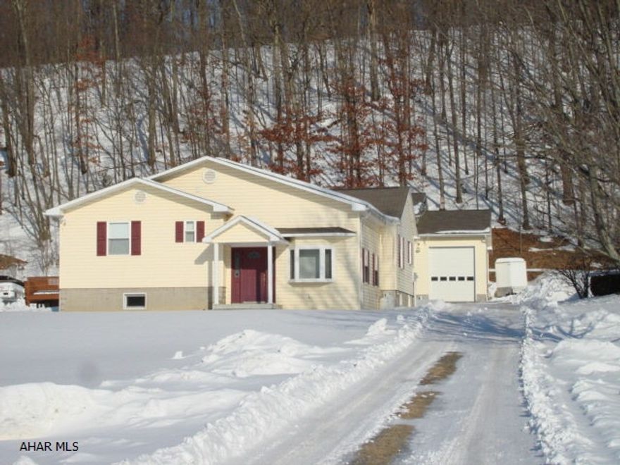 Lovely updated ranch on 2.2 acres, boasts 4 bedrooms, 2 bathrooms, modern kitchen with Jen-Air stove, eating area at counter, dining room with hardwood floors, sunken Great Room with gas stone fireplace, office and a family room with bar. Very efficient floor plan. The house has zoned heat, (oil hot water).  The 40x50 (6 plus bays) garage is great for the car enthusiast with a 12 foot big door. The garage is heated and air conditioned. Above the garage is a very large apartment consisting of 2 bedrooms, 1 full bathroom, large living/family room, a dining area and a complete kitchen. An above ground pool completes the picture. Located in Snyder Township the no zoning will allow for many possibilities for use. A wonderful property that has to be seen to realize what is there.