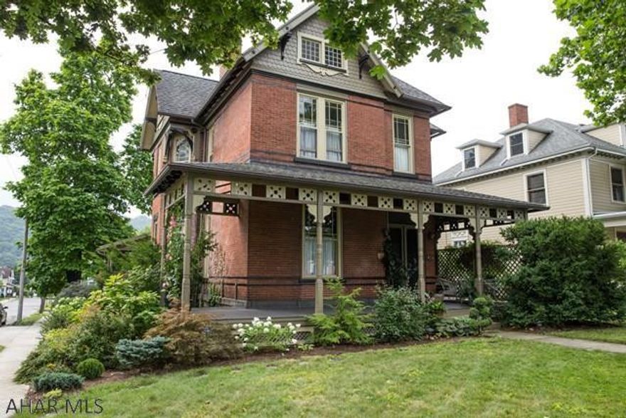 Impressive front entry with a carved winding staircase  complete with stained glass windows circling up to the 2nd floor. A large state of the art kitchen including  2 full ovens a built in grill,  all perfect for the gourmet cook. A large bay window over the sink looks out over the patio and the breathtaking flower garden. A  large separate eating area with pantry completes this beautiful kitchen. Two fireplaces, pocket doors, 12 Ft ceilings, window seats and stained glass windows all speak to the original feel of this amazing home. This home has both a large living room and a sitting/family room on the first floor. The 16 ft DR will please any size family. The second floor offers 4 bedrooms and a large bath. What a gem!