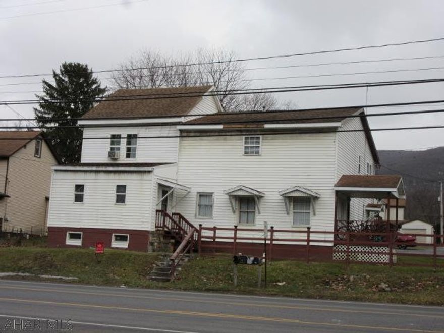 4 unit apartment building with all units currently rented, there is well water at the property and city water ran to the property, plans approved by Logan Township for 4 additional units to be built on the lot, each unit has it's own laundry hook-up, hardwood and laminate flooring, owner pays water, sewer, gas and some electric