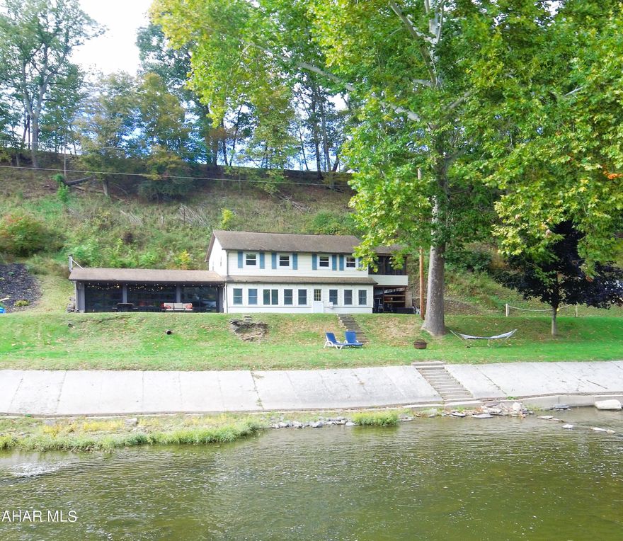 Hard to find cottage located along the Raystown Branch of the Juniata River. The cottage comes furnished and offers 3 Bedrooms, 2 Baths, kitchen, living room, laundry room, screened in porch overlooking the River, and an awesome entertaining area that was converted from a garage. This property would make a great place to kick back and relax, with plenty of area to entertain your friends and family. Located not far from Raystown Lake and State Game Lands. No Drive-bys on the Weekends and all showings are by appointment only!
