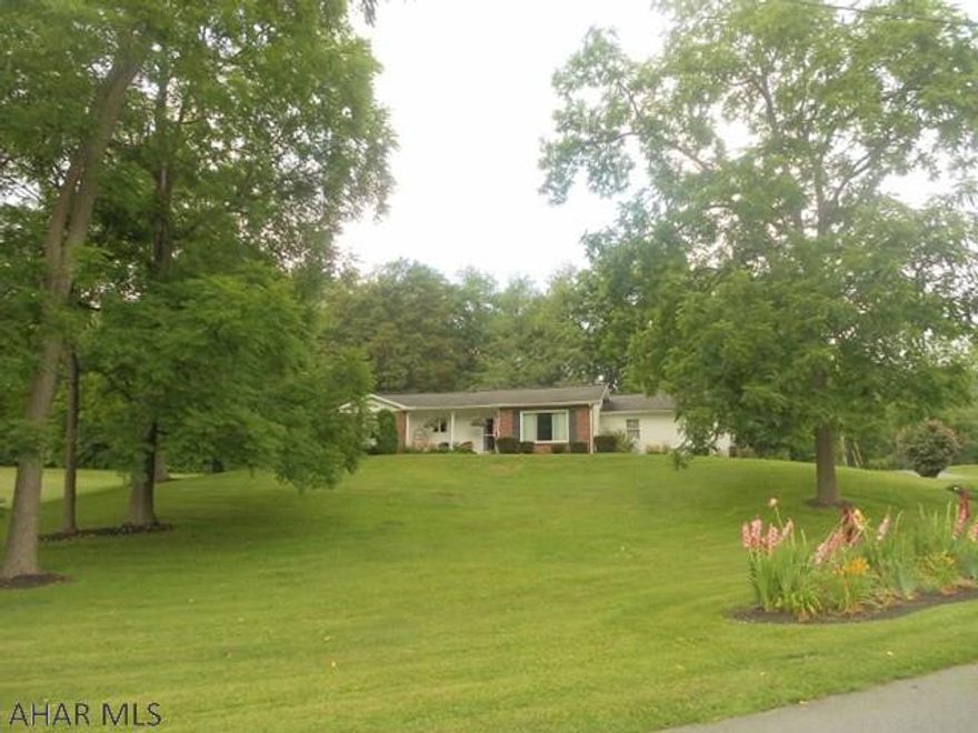 If you are looking for a nice yard, with lovely landscaping and a well-built ranch home with 2 car garage, look no further. This home has a new efficient heat pump for heat and central air. New carpet and hardwood floors. Knotty pine kitchen cabinets. Cozy, clean, and move-in ready with many more inviting features. 2 car attached garage. New rear cement patio with pergola. Call to see this one!