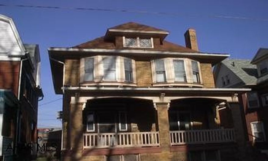 Spacious 2 1/2 sotry, 3 bedroom home with a unique fireplace, new carpeting and more.  Must see inside. Owner wants offers.